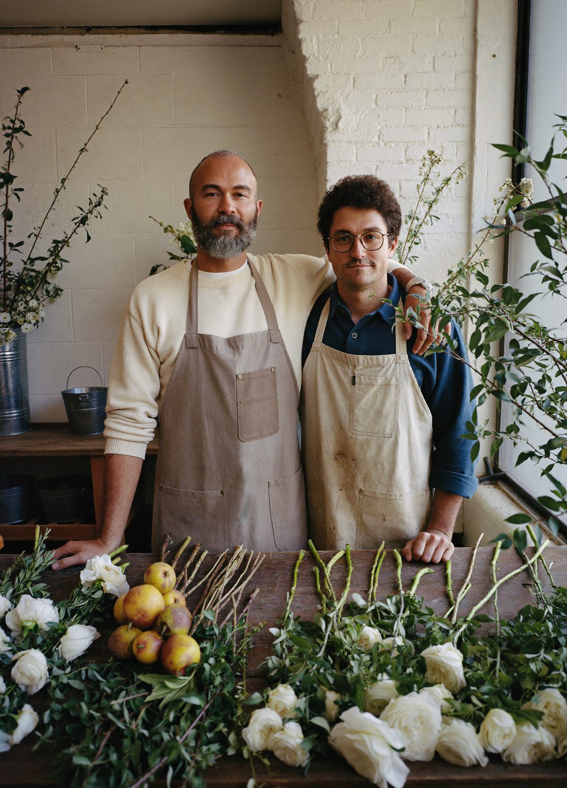 Owen Calloway and Teo Marchetti at the work table in the studio