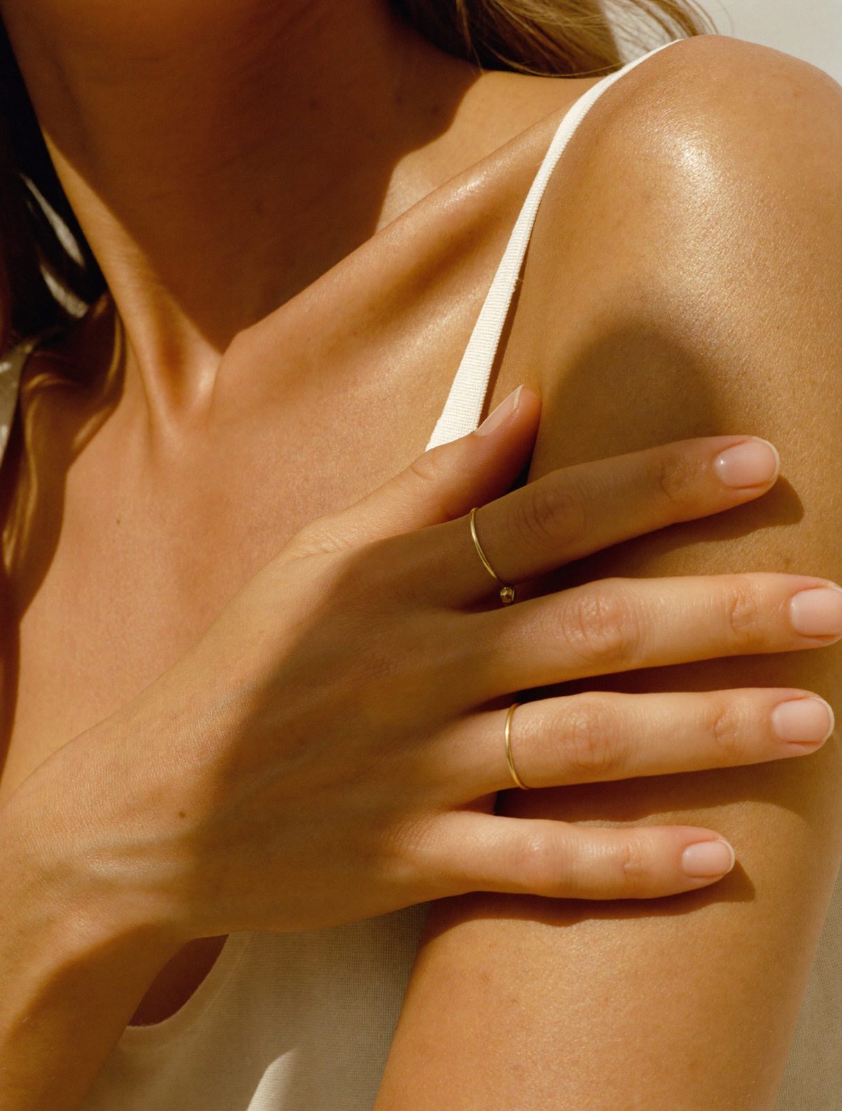 Sunlit freckled shoulder with a soft natural glow