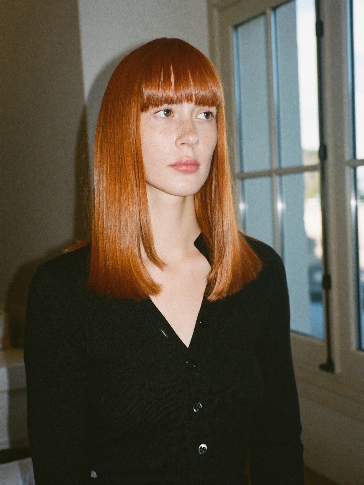 Glossy copper hair with a curtain fringe