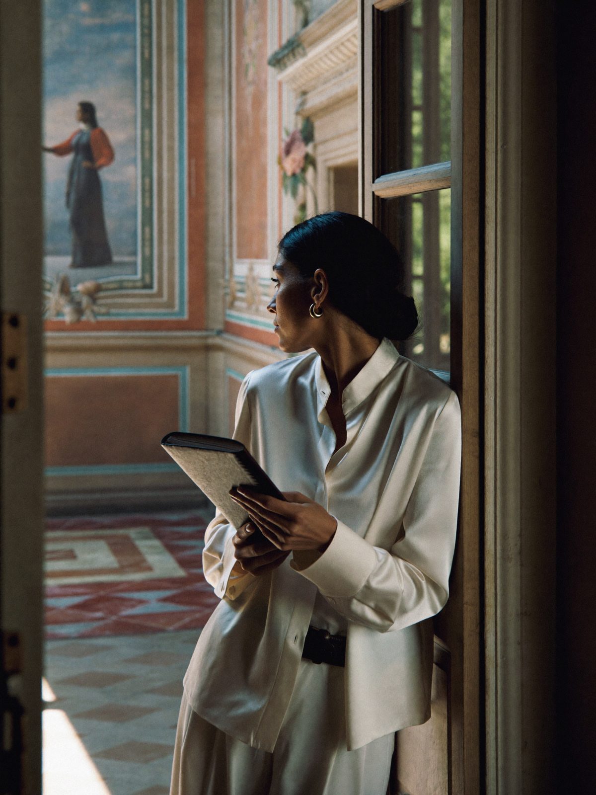 Chiara Bellandi, founder of Oleander, in the doorway of a Roman villa